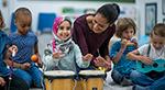 Teacher playing drums with student